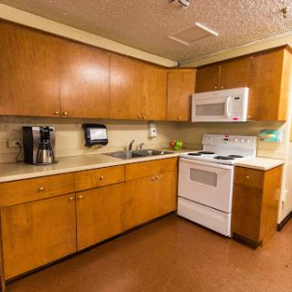 A well-equipped kitchen featuring wooden cabinets and modern appliances.