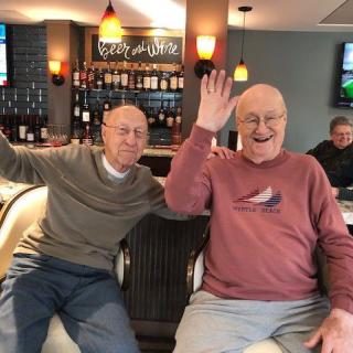 Two friends enjoying a moment together at the bar.