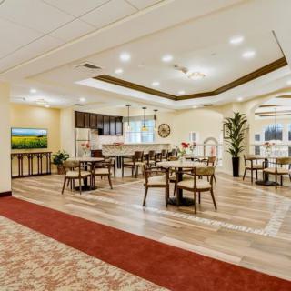 Spacious and elegantly decorated dining area with modern furnishings.