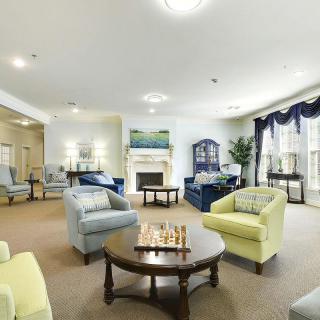 A cozy living room with comfortable seating and a fireplace.