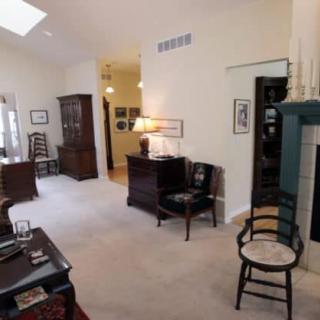 A cozy living room with classic furniture and warm lighting.