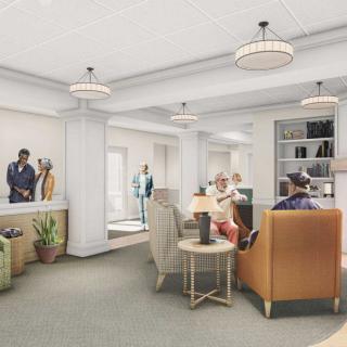 A cozy lobby area with comfortable seating and people engaged in conversation.