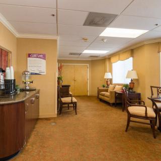 A welcoming waiting room with comfortable seating and a coffee station.