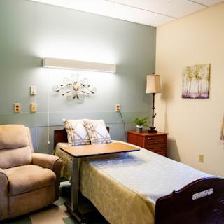 A cozy and well-lit patient room in a hospital.