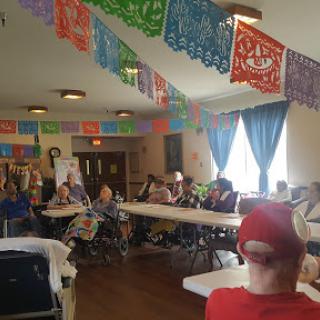 Community gathering adorned with colorful decorations.