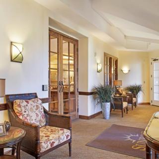 A well-furnished hotel lobby with comfortable seating and elegant decor.