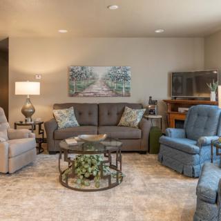 A cozy living room with comfortable seating and stylish decor.