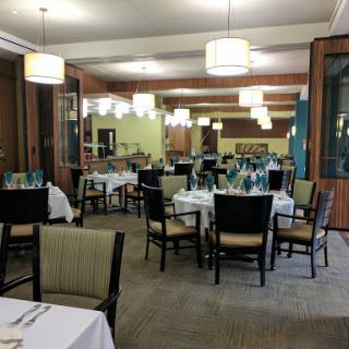 A spacious and elegantly arranged dining area in a restaurant.