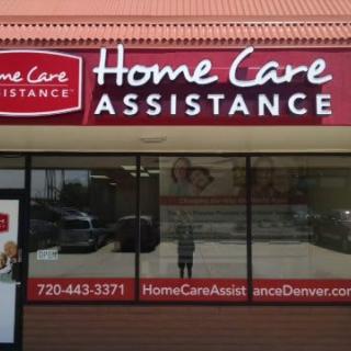 Storefront of Home Care Assistance with contact information and website displayed.