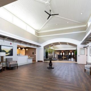 A spacious and modern lobby area with ample natural light and comfortable seating.