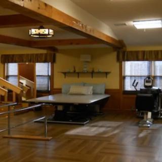A physical therapy room equipped for rehabilitation exercises.