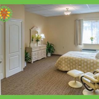 A well-decorated modern bedroom with a comfortable bed and elegant furnishings.