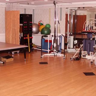 A well-equipped gym with various exercise machines and equipment for fitness training.
