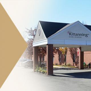 The welcoming entrance of Kitzmann's, showcasing its inviting architectural design.
