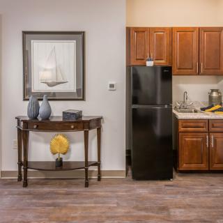 A cozy kitchen with wooden cabinetry and modern dcor.