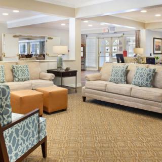 A modern and cozy living room with sofas and stylish decor.