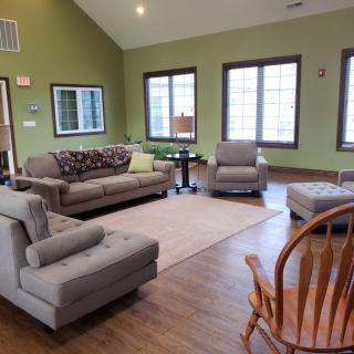 A cozy living room with comfortable seating and natural lighting.