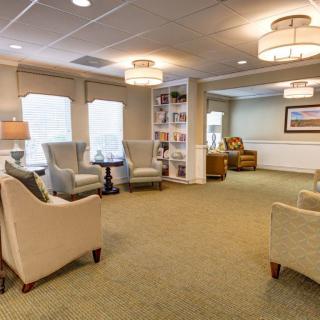 A cozy living room with comfortable seating and soft lighting.