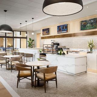 A modern cafe interior with elegant seating and lighting.