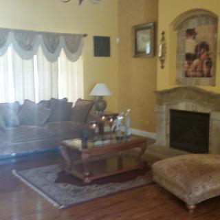 Cozy living room with a sofa, coffee table, and fireplace.