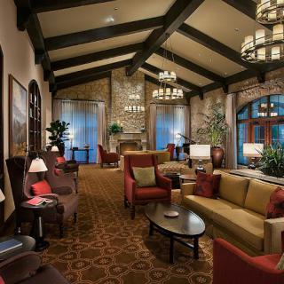 A luxurious and cozy lounge with elegant furniture and ambient lighting.