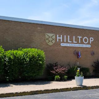 Exterior view of the Hilltop building with well-maintained landscaping.