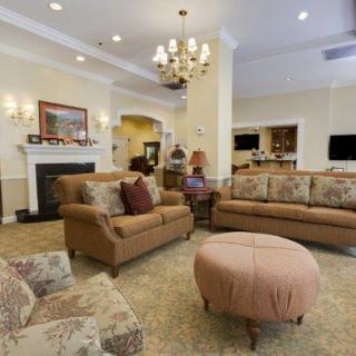 A cozy living room with elegant furniture and a warm atmosphere.