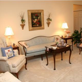 Cozy living room with elegant furniture and warm lighting.