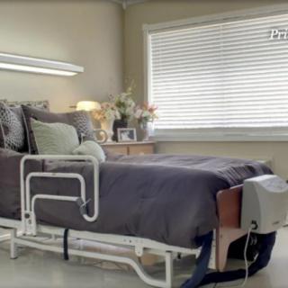 A hospital-style bed in a well-lit room with modern decor.