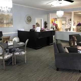 A welcoming lobby with comfortable seating and a reception desk, designed for relaxation and interaction.
