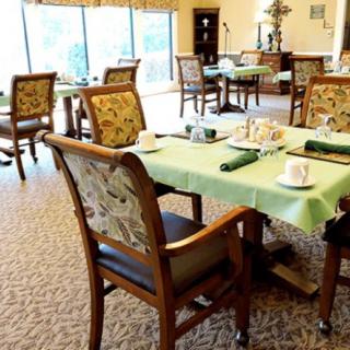 A cozy dining area with tables set for guests.