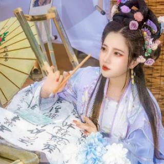 A young woman in traditional Chinese attire practices calligraphy, surrounded by artistic elements.