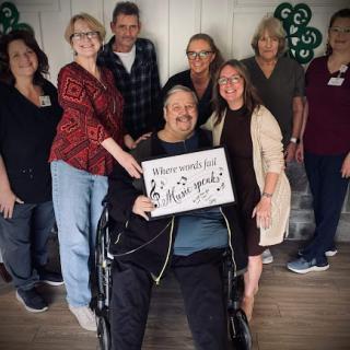 A joyful gathering celebrating a special moment with smiles and camaraderie.