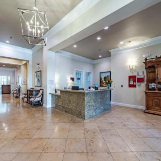 Spacious and elegant lobby with a reception desk and stylish decor.