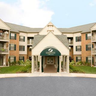Front entrance of a hotel with a welcoming awning.