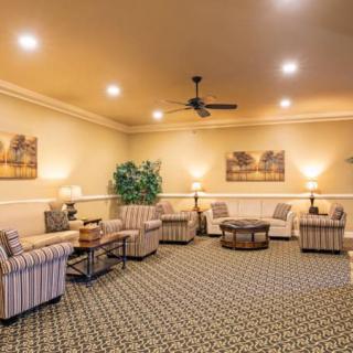 A well-furnished living room with comfortable seating and elegant decor.