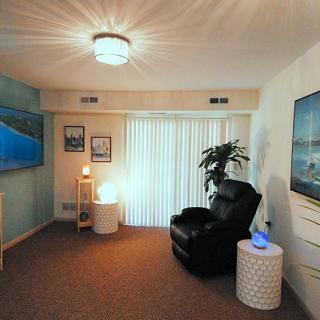 A cozy living room with modern furnishings and soft lighting.