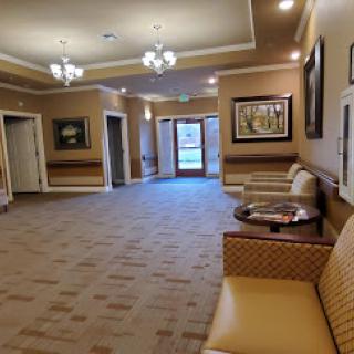 A spacious and inviting lobby featuring comfortable seating and elegant lighting.