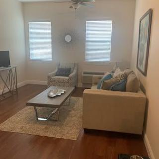 A cozy living room with modern decor and furniture.