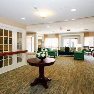 A well-furnished lobby with comfortable seating and elegant decor.