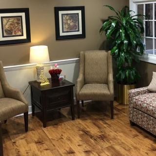 A cozy living room with comfortable seating arrangements and stylish decor.