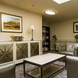 A cozy living room with modern furniture and tasteful decor.