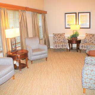A cozy living room with comfortable seating and warm lighting.