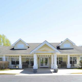 A residential building with a welcoming entrance and pitched roof.
