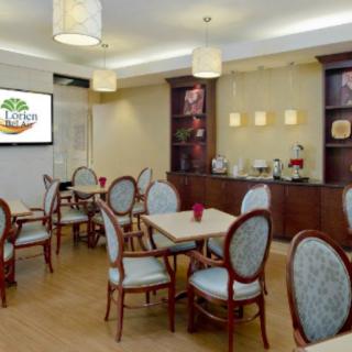 An elegant indoor dining area with neatly arranged tables and chairs.