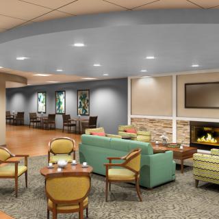 A cozy waiting room with comfortable seating and warm lighting.