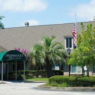 Entrance of a building with an awning and American flag.
