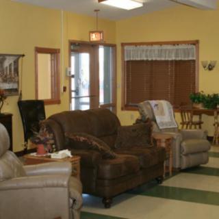 A cozy living room with sofas and chairs arranged in a comfortable setting.