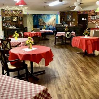 A cozy dining area with red checkered tablecloths, perfect for a casual meal.