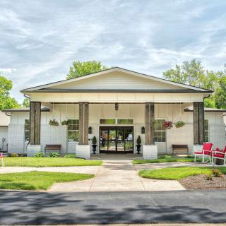 A modern building with a welcoming entrance and well-maintained landscaping.